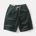 Men's khaki retro cargo shorts with multiple pockets on a straight-leg fit.