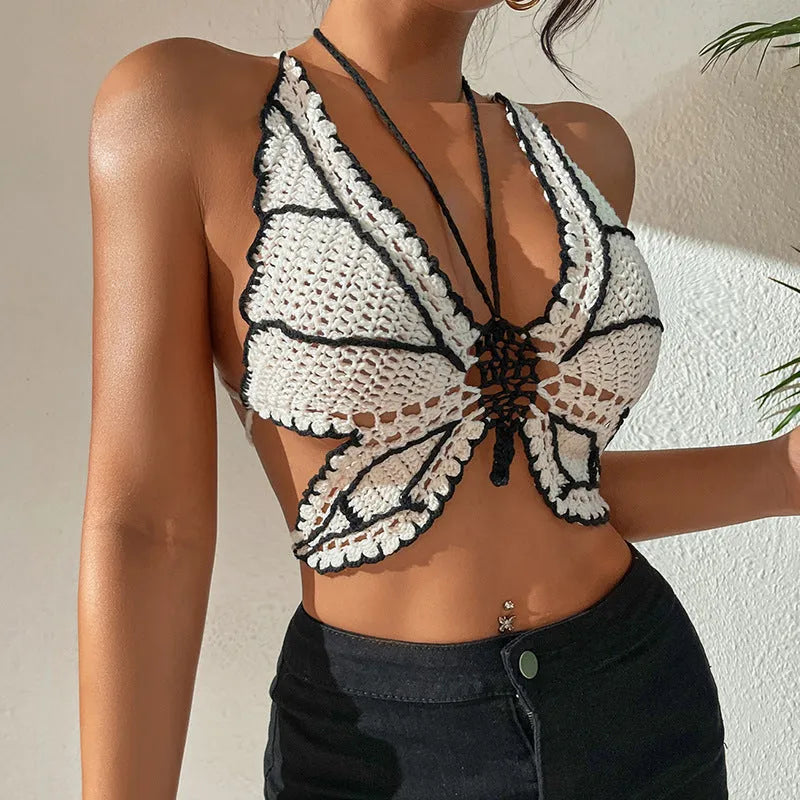 Women's classic black and white bikini swimsuit on a hanger.