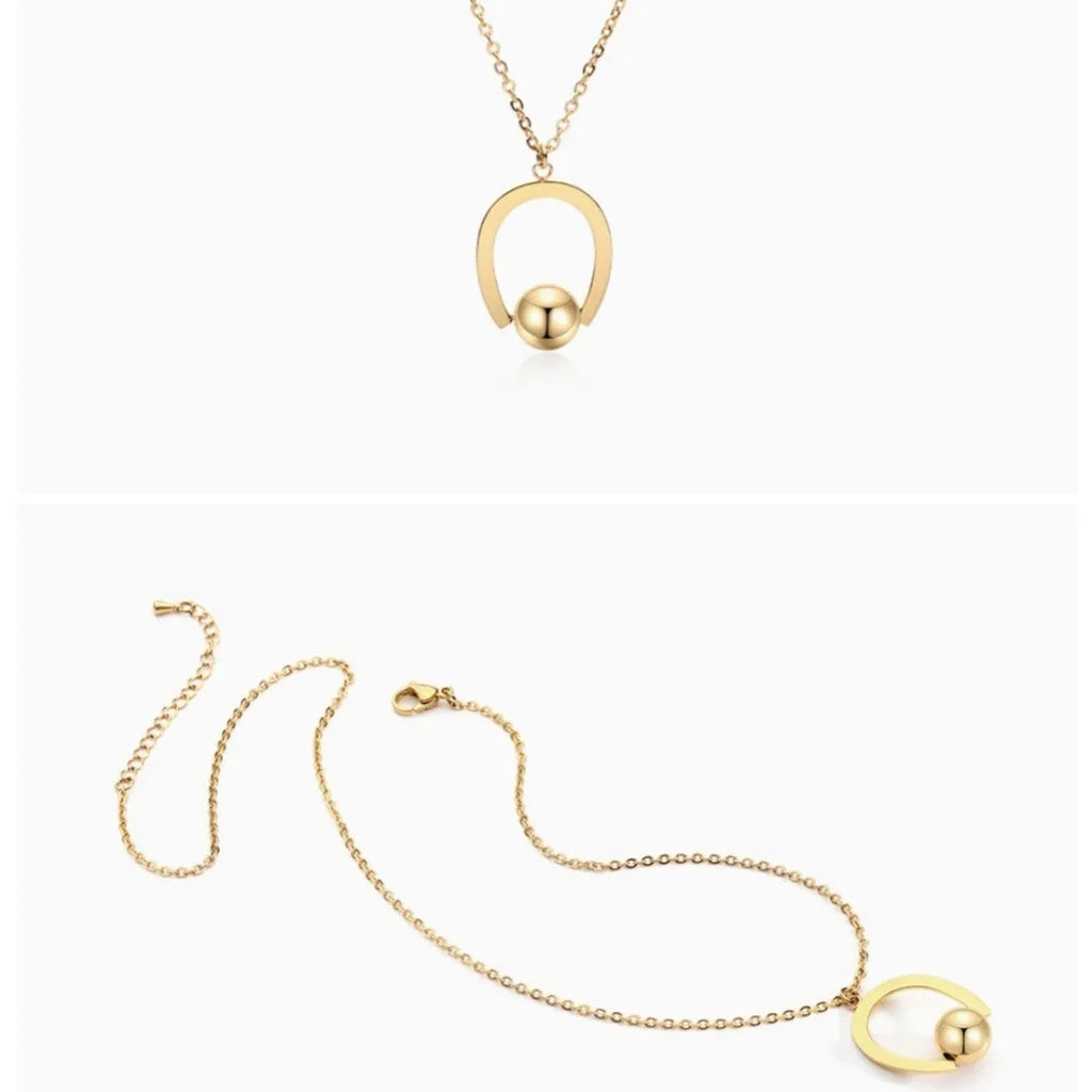 Adjustable stainless steel necklace with geometric pendant on a cross chain in gold finish.