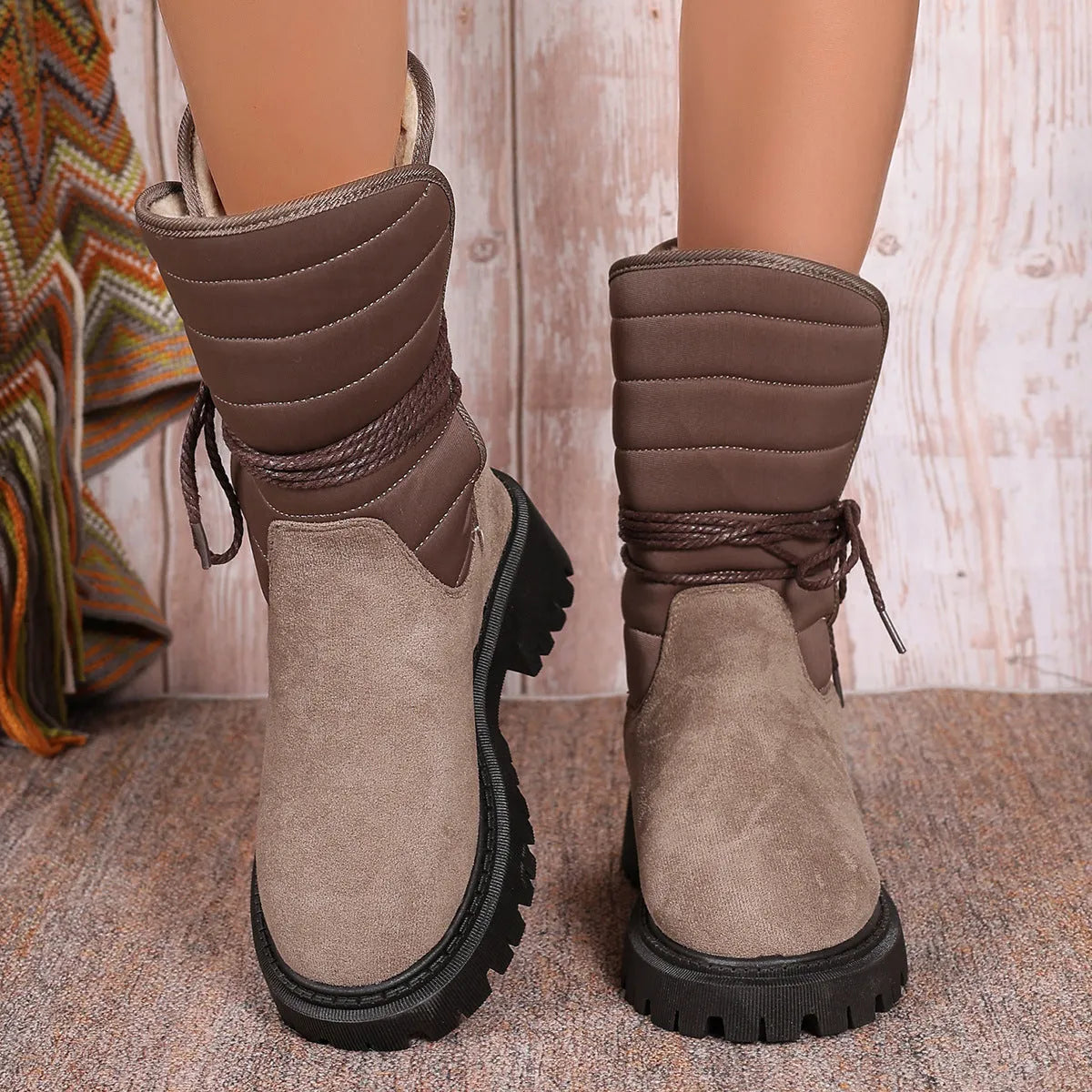 Women's chunky heel mid-calf snow boot with lace-up front and fleece lining in black, brown, or grey.