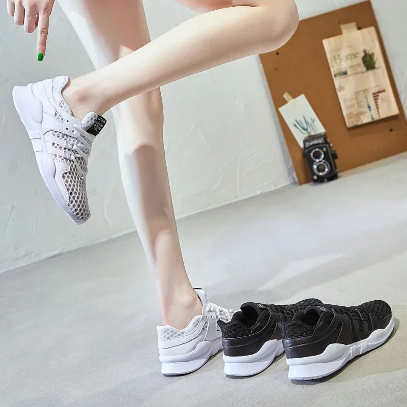 Breathable hollow mesh sneakers in black and white colours with round toe design