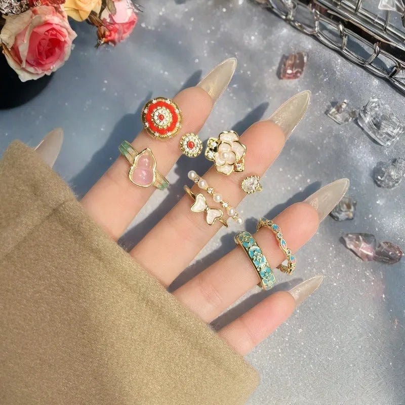 Women's adjustable copper ring with gourd design, flower and bow motifs, and inlaid zircon stones in a vintage oil dripping finish.