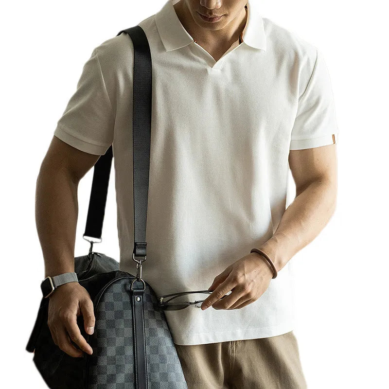 Men's blue short-sleeved cotton blend polo shirt on a hanger, showing regular fit and casual style.