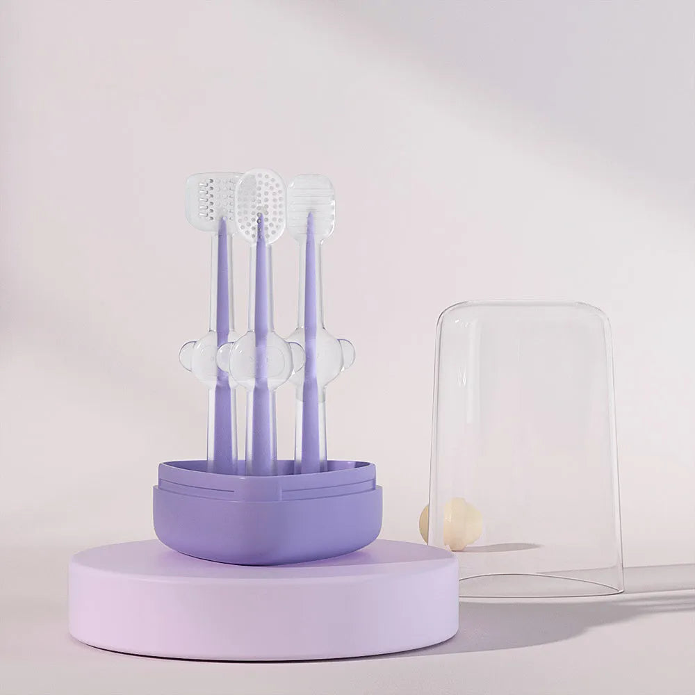 Soft silicone pet toothbrush for dogs and cats in purple, blue, and green colours with ergonomic handle.