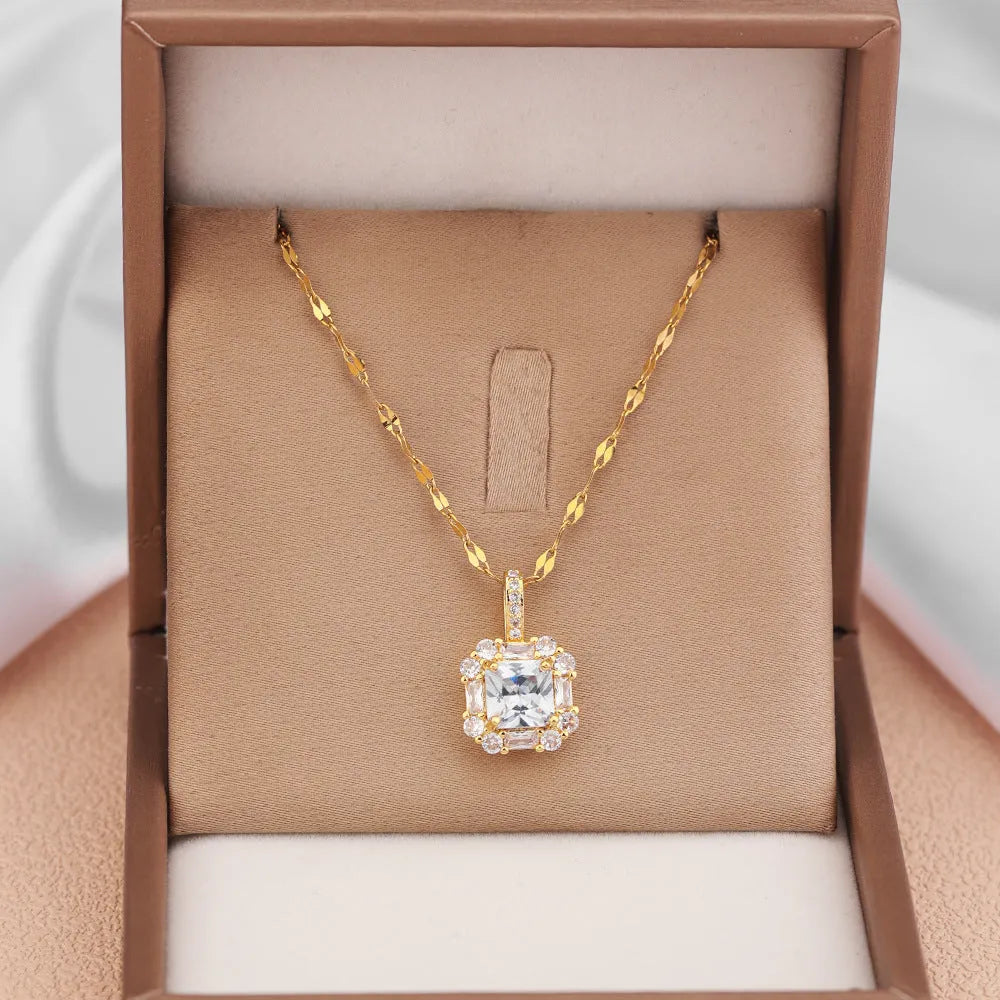 Gold geometric quadrilateral pendant necklace with mixed gemstones on a water wave chain.