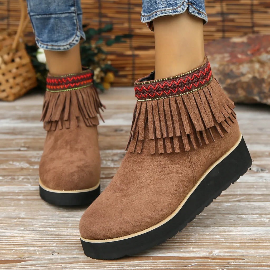 Women's dark brown suede wedge ankle boots with side zip and decorative tassel.