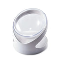 White elevated tilted plastic cat food bowl on a flat surface