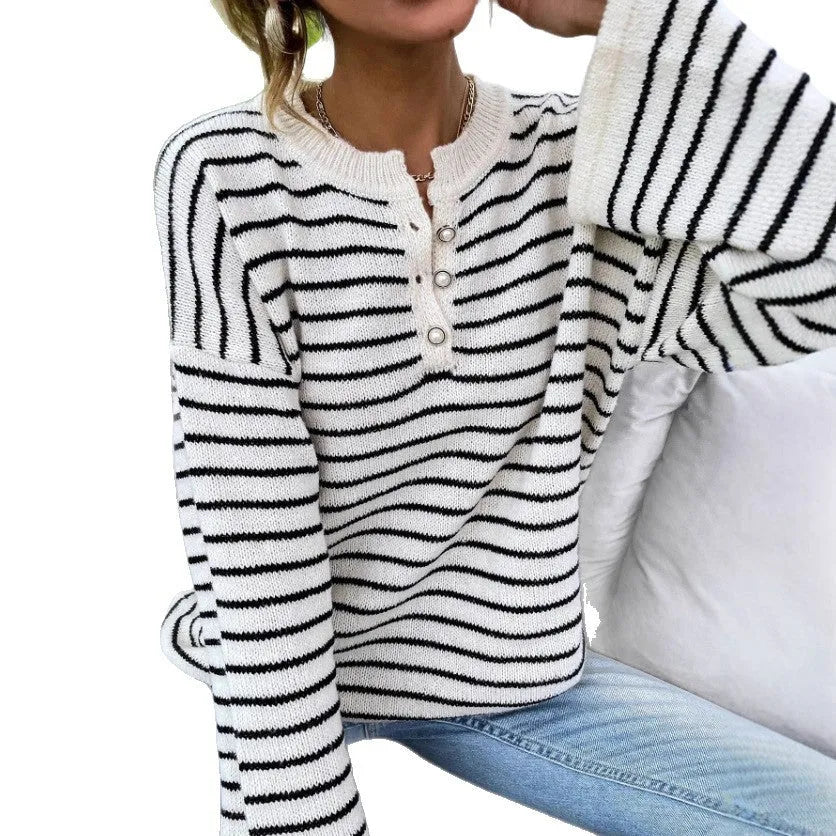 Women's black striped loose top with drop shoulders and button accents