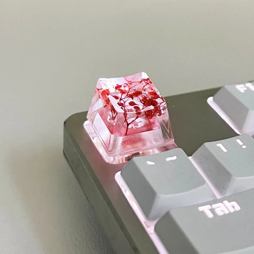 Transparent resin starry sky keycap for mechanical keyboards in green, measuring 1.8cm by 1.2cm.
