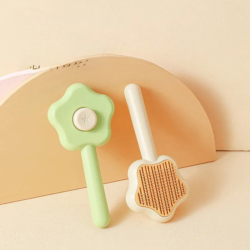 Green stainless steel cat grooming comb with self-cleaning mechanism and four rows of needles