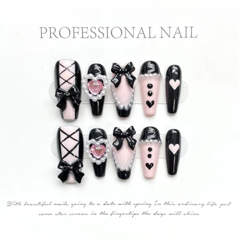 Black and pink heart design hand-painted manicure nails with cat's eye styling