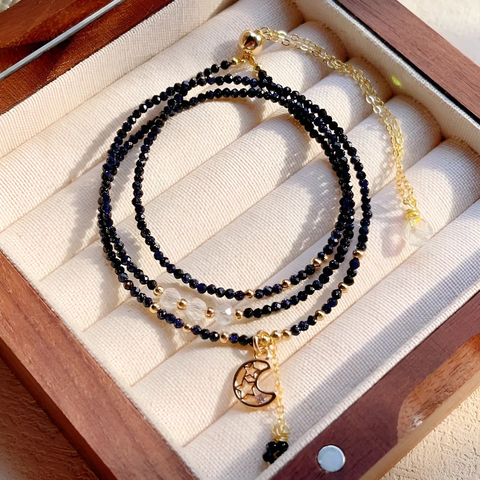 Blue gold sand stone cut women's bracelet with three interlocking rings in multi-layer design