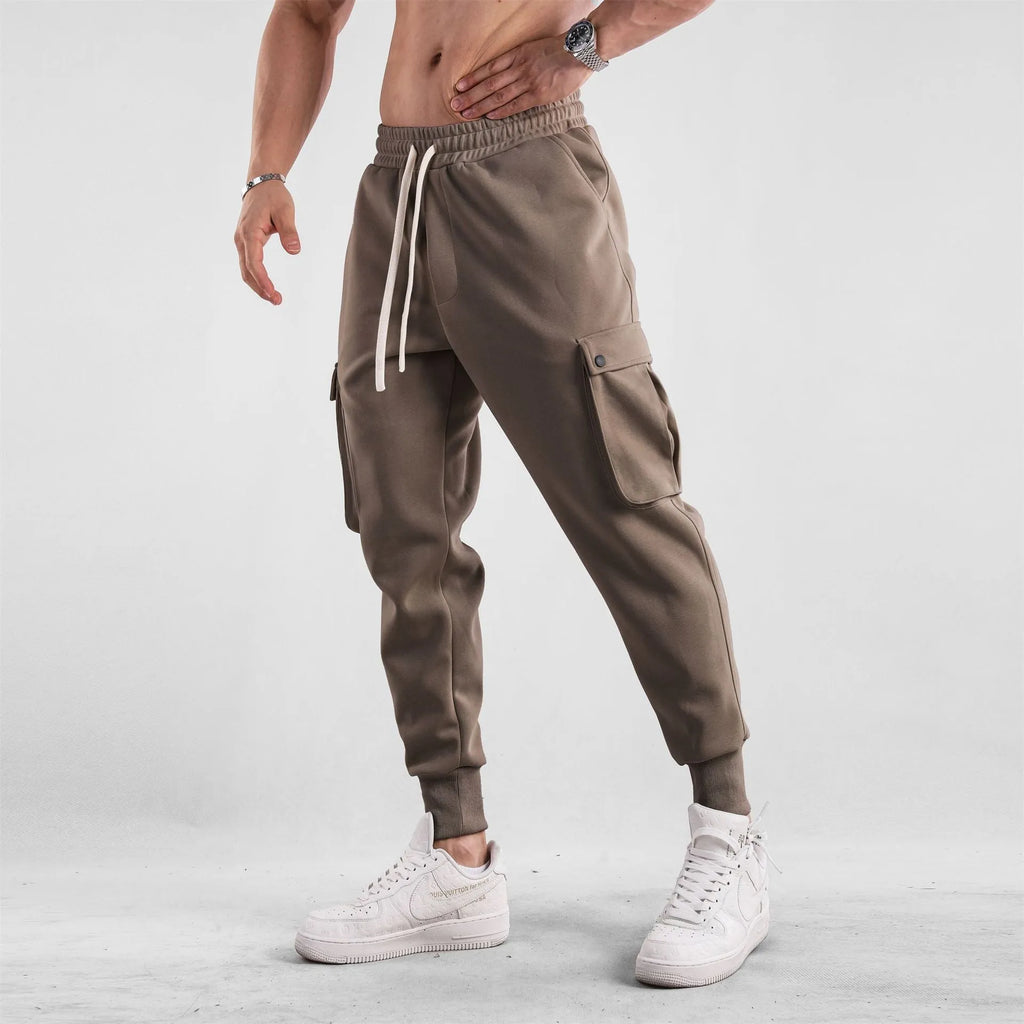 Men's loose fit cotton sports trousers with ankle tie detail and multiple pockets in various colour options