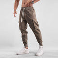 Men's loose fit cotton sports trousers with ankle tie detail and multiple pockets in various colour options