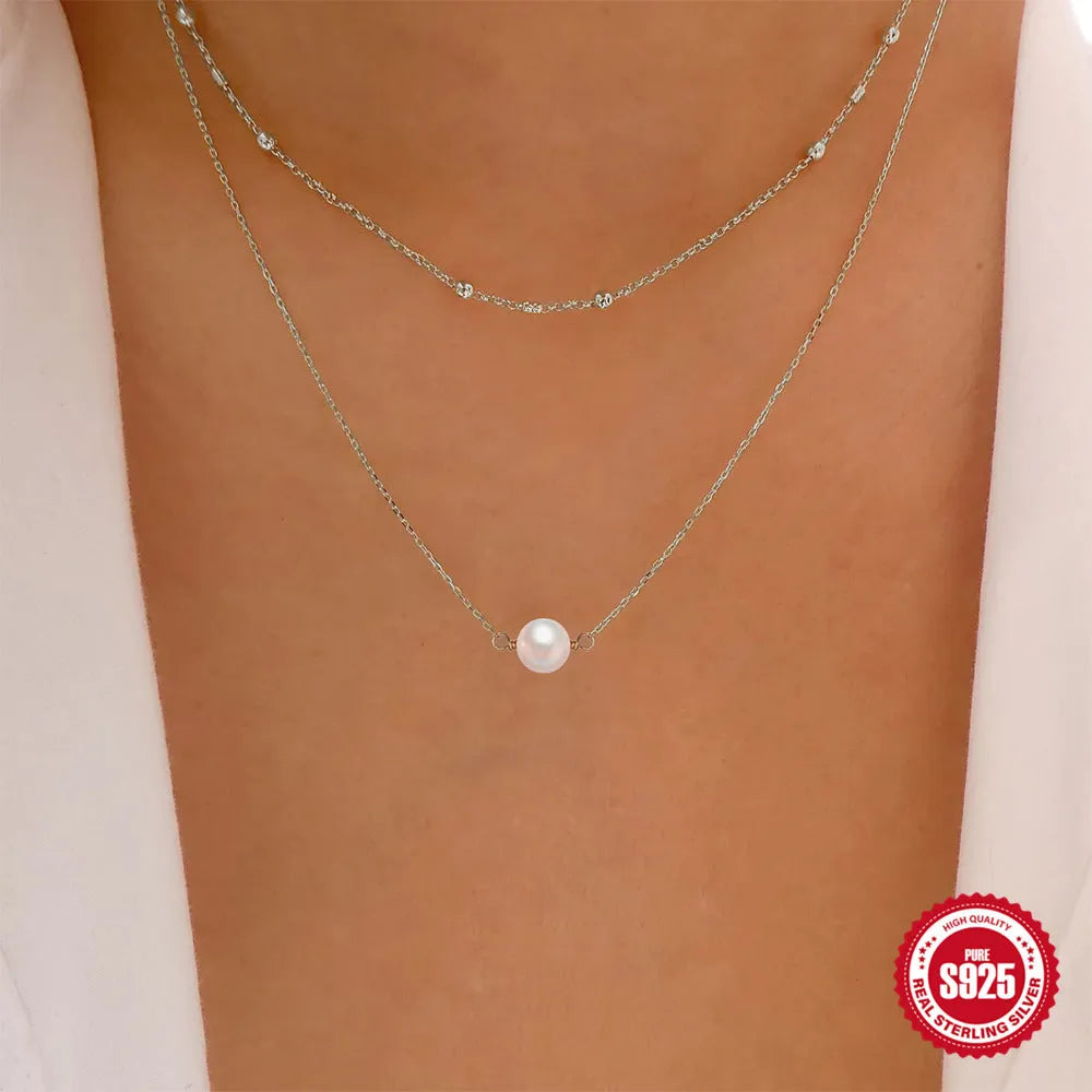 S925 sterling silver double layer necklace with geometric twin pearl pendant on a ball bead chain.