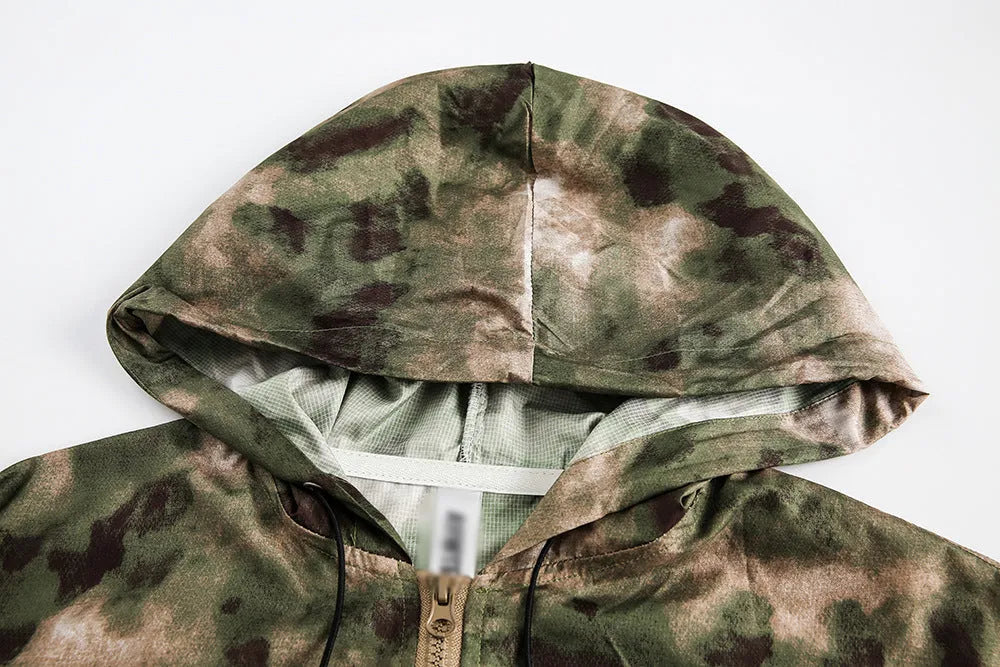 Hooded camouflage sun protection jacket for men, loose fit polyester fibre, shown in camouflage colour.