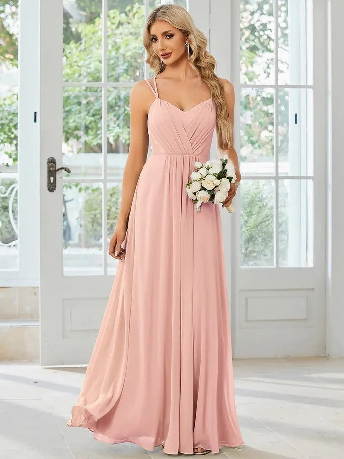 Women's sleeveless A-line long pleated dress in light green polyester fabric.