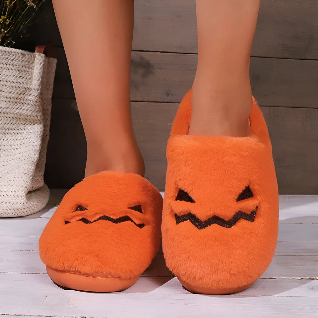 Orange Halloween pumpkin slippers with coral velvet upper and plush lining for indoor winter wear