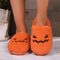 Orange Halloween pumpkin slippers with coral velvet upper and plush lining for indoor winter wear