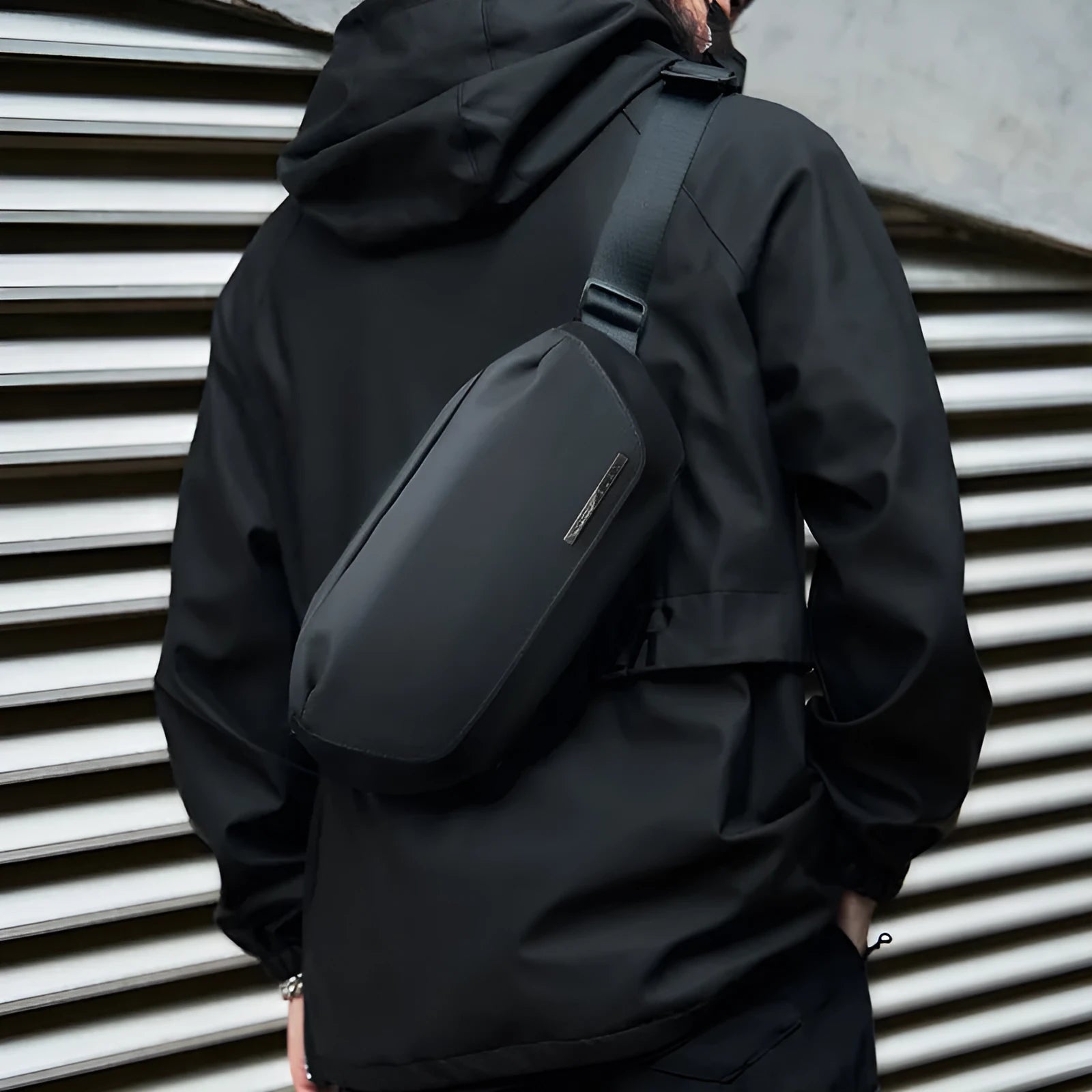 Black Oxford cloth men's messenger bag with cross-body strap.
