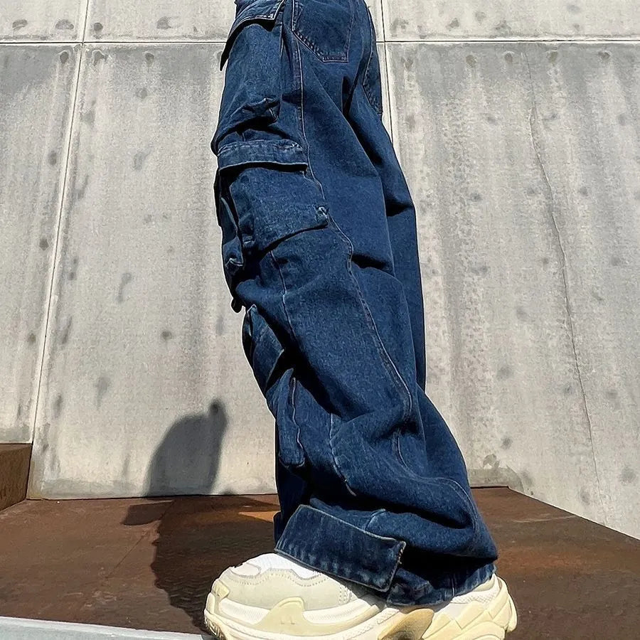 Dark blue distressed wide-leg women's jeans with high waist and multiple pockets.