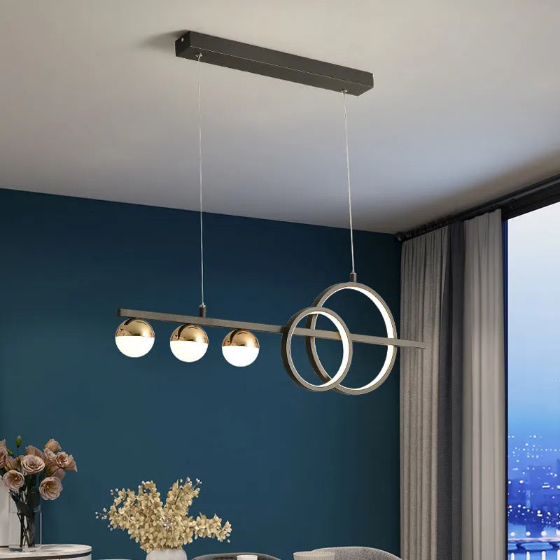 Rectangular aluminium ceiling light in black or gold finish with remote control for white and three-colour dimming.