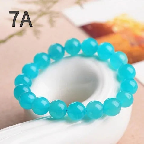 Grade 7A Amazonite natural stone scattered beads arranged on a bracelet, showing blue-green colour and polished finish.