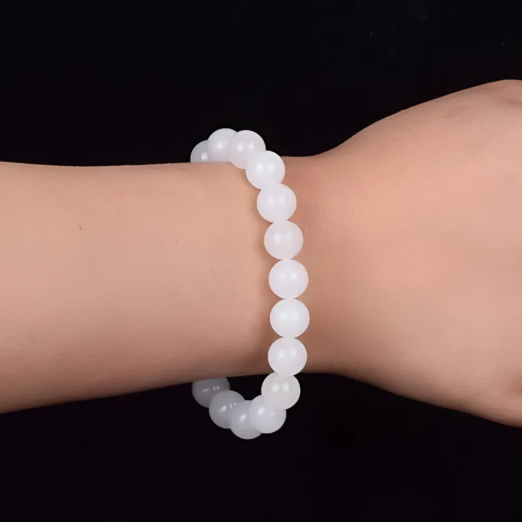 Hotan white jade goat fat round bead bracelet 10mm Hetian jade unisex national style on light background