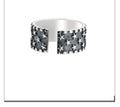 Adjustable sterling silver ring with geometric five-pointed star pattern