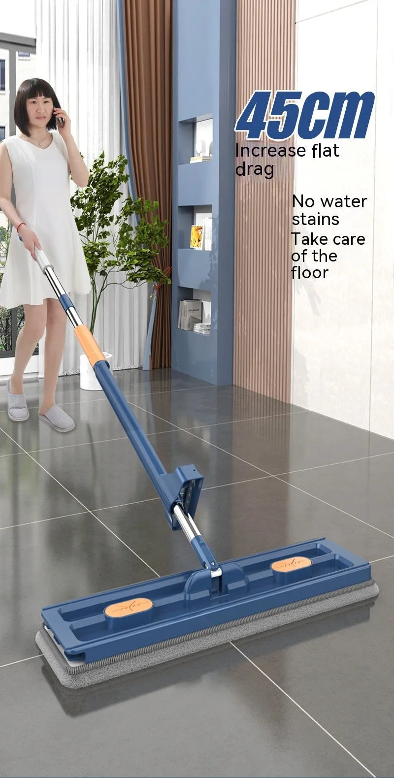 Large flat mop with stainless steel handle and blue mop cloth on hard floor
