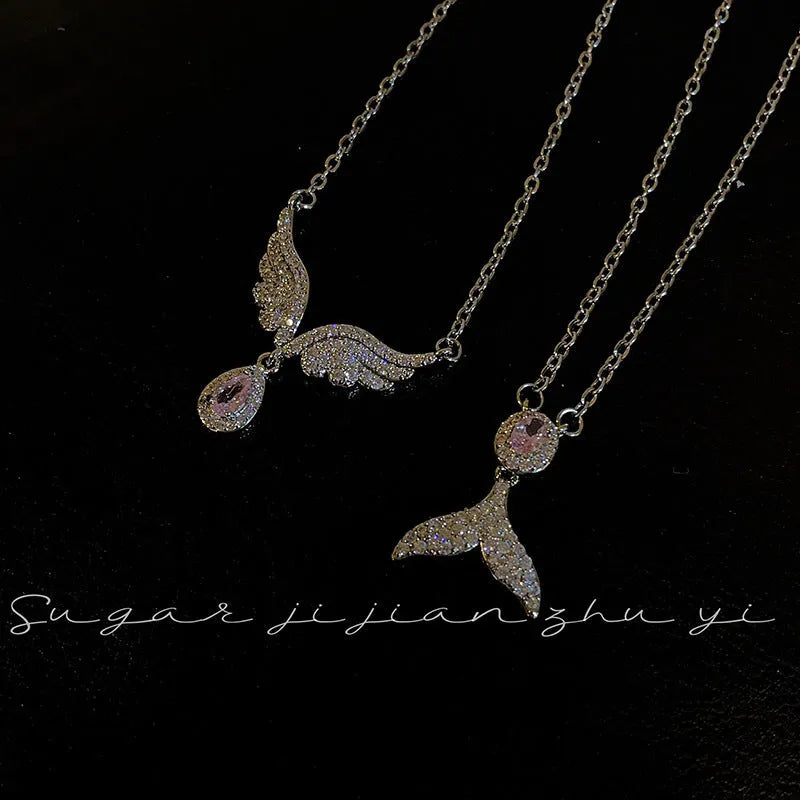 Women's sterling silver fishtail pendant necklace on an adjustable O-ring chain.