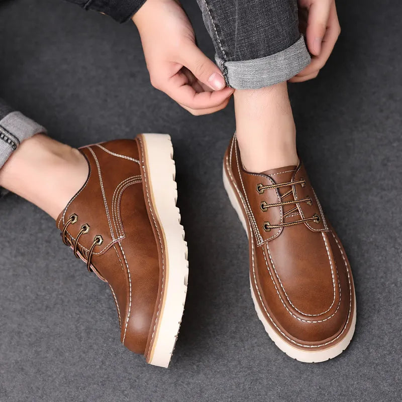 Men's black retro low-top Martin boots with a round toe and mid-height heel on a rubber sole.