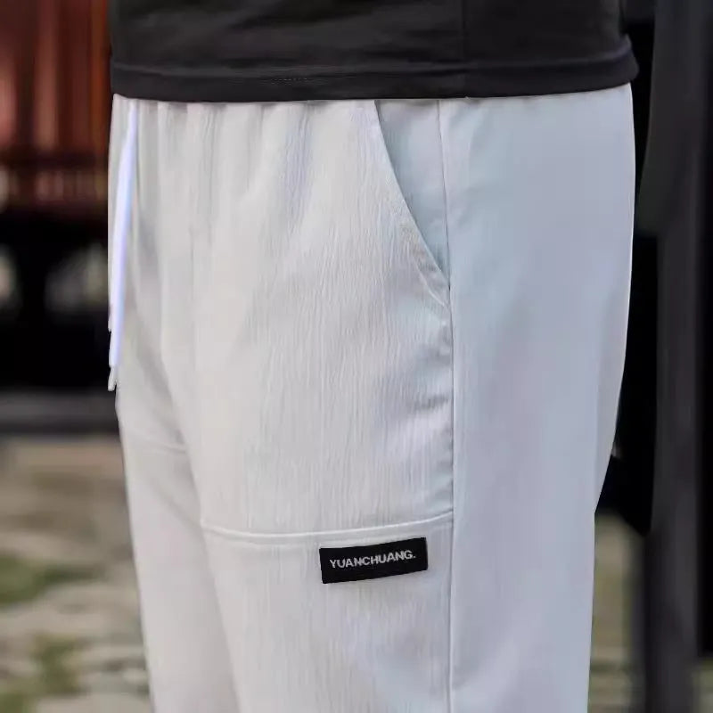 Men's lightweight polyester trousers for spring and autumn in light grey colour