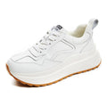 Women's white cowhide leather casual sports shoes with lace-up front and cross strap detail