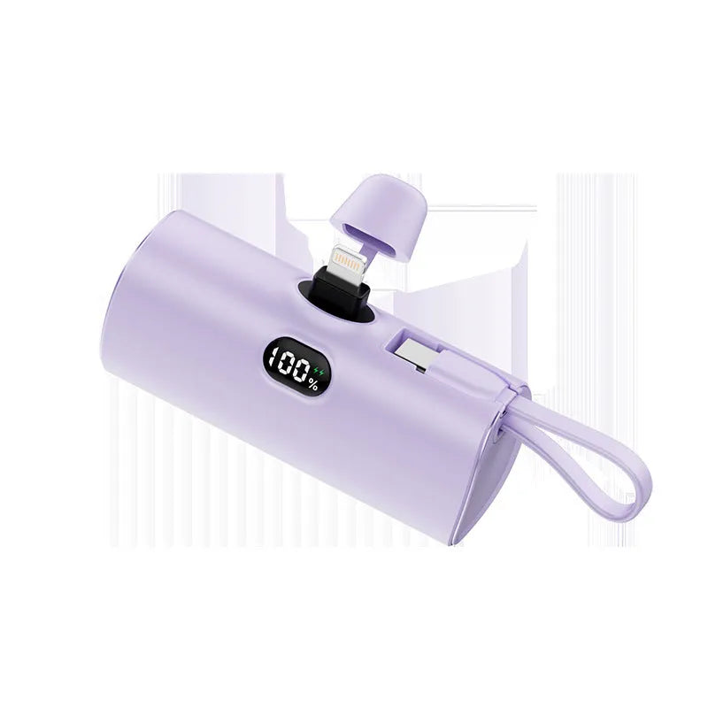 Compact wireless power bank with digital display showing battery percentage and built-in folding plug