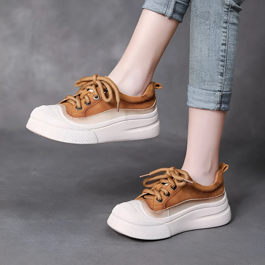 Yellow women's leather lace-up casual shoes with round toe on a plain background.