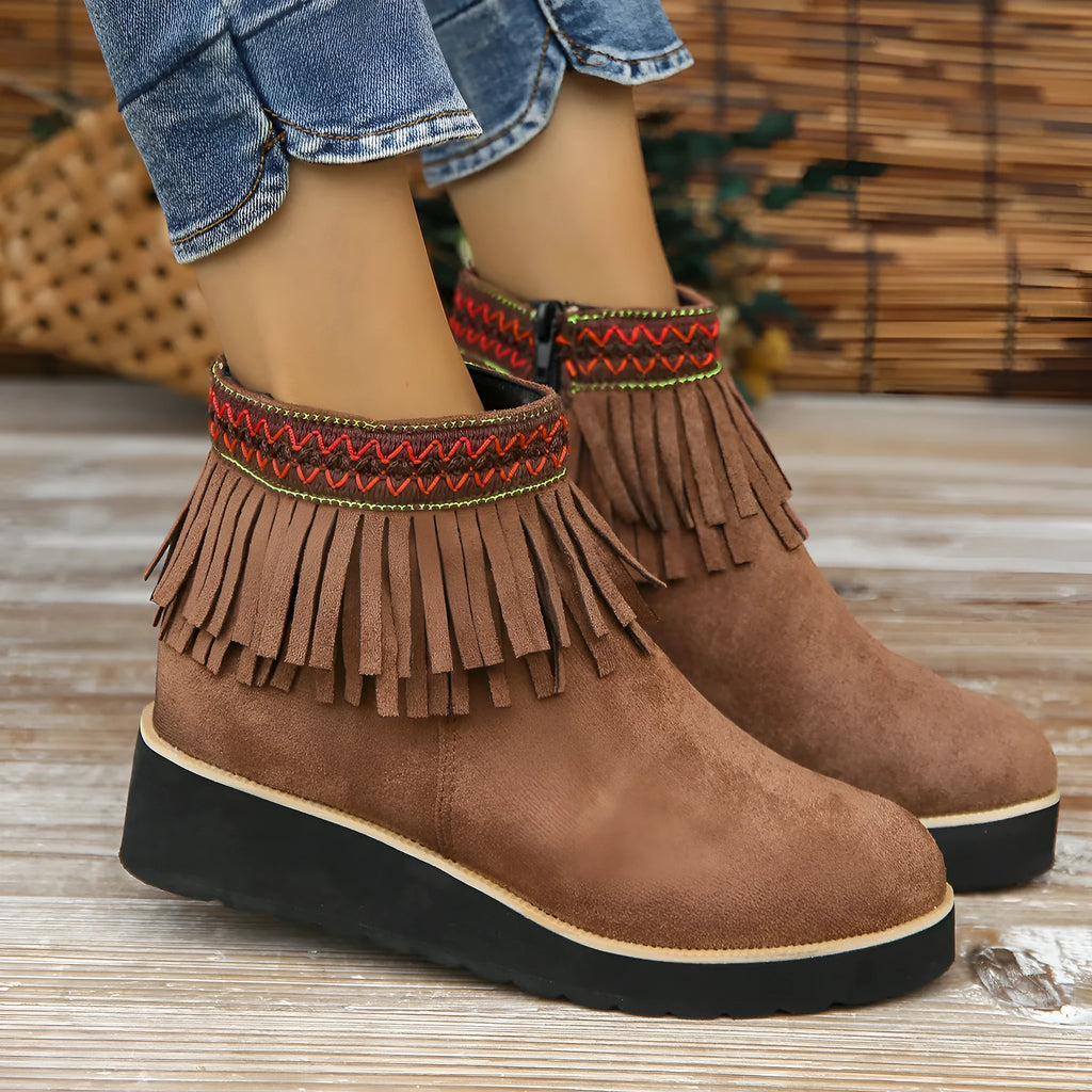 Women's dark brown suede wedge ankle boots with side zip and decorative tassel.