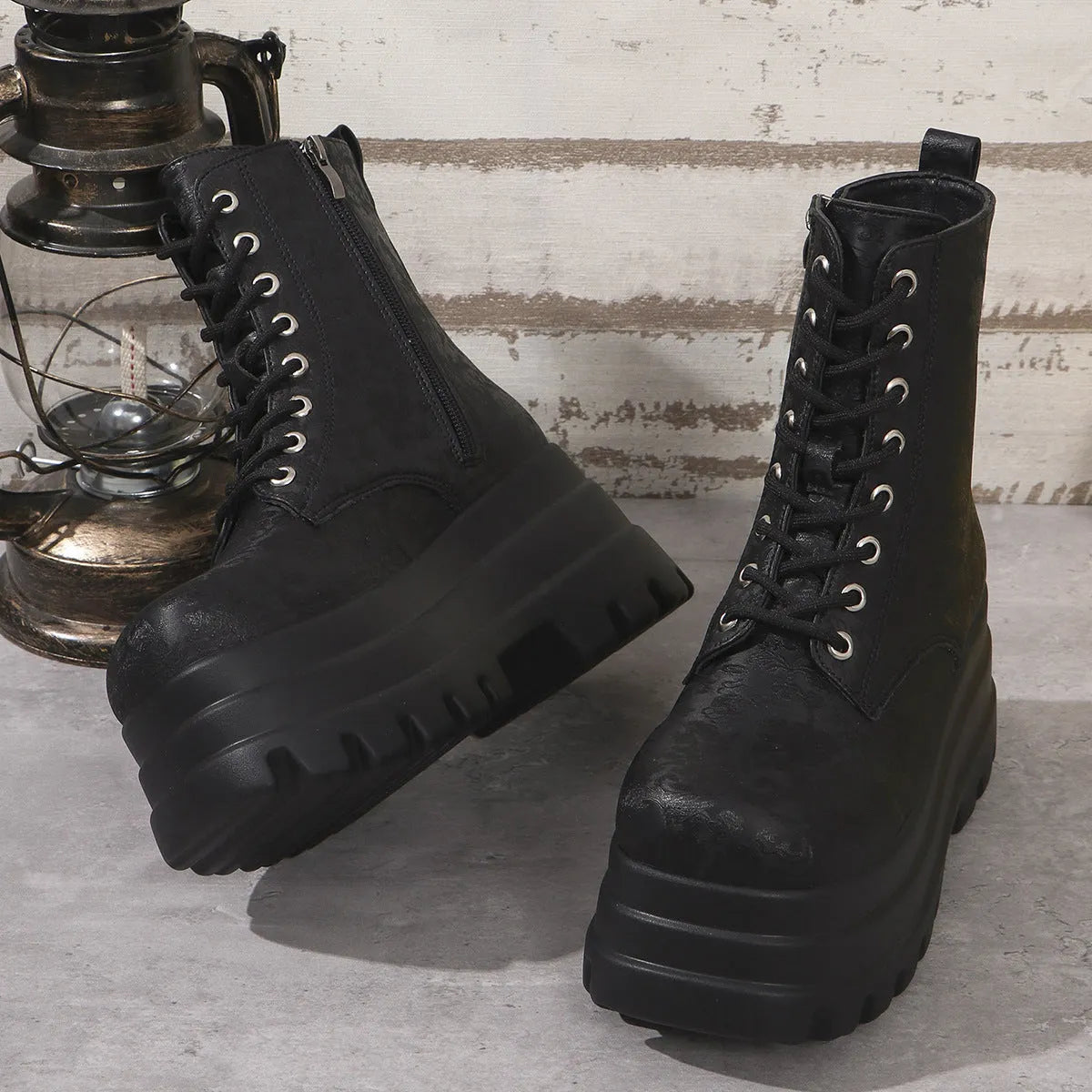 Women's white retro platform martin boots with patchwork detail and a side zip.