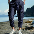 Men's linen casual trousers with elastic drawstring waist and ankle-tied cuffs in solid colours