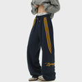 Men's striped loose straight-leg casual pants in Black, front view, showing wrinkle-free fabric and straight leg cut