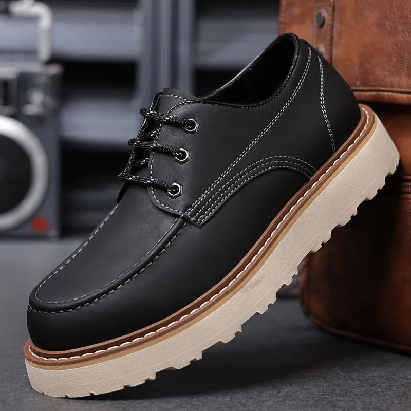 Men's black retro low-top Martin boots with a round toe and mid-height heel on a rubber sole.