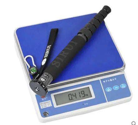 Black carbon fibre camera monopod extended to show six telescoping sections