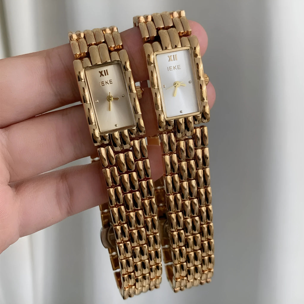 Women's mid-century bracelet watch with 15mm dial, mineral glass, and butterfly buckle in gold or silver options
