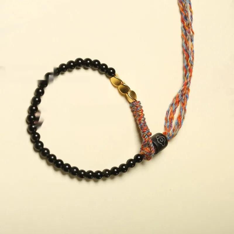 Hand-woven obsidian carrying strap showing 4mm width and adjustable length for phones, keys, or cameras