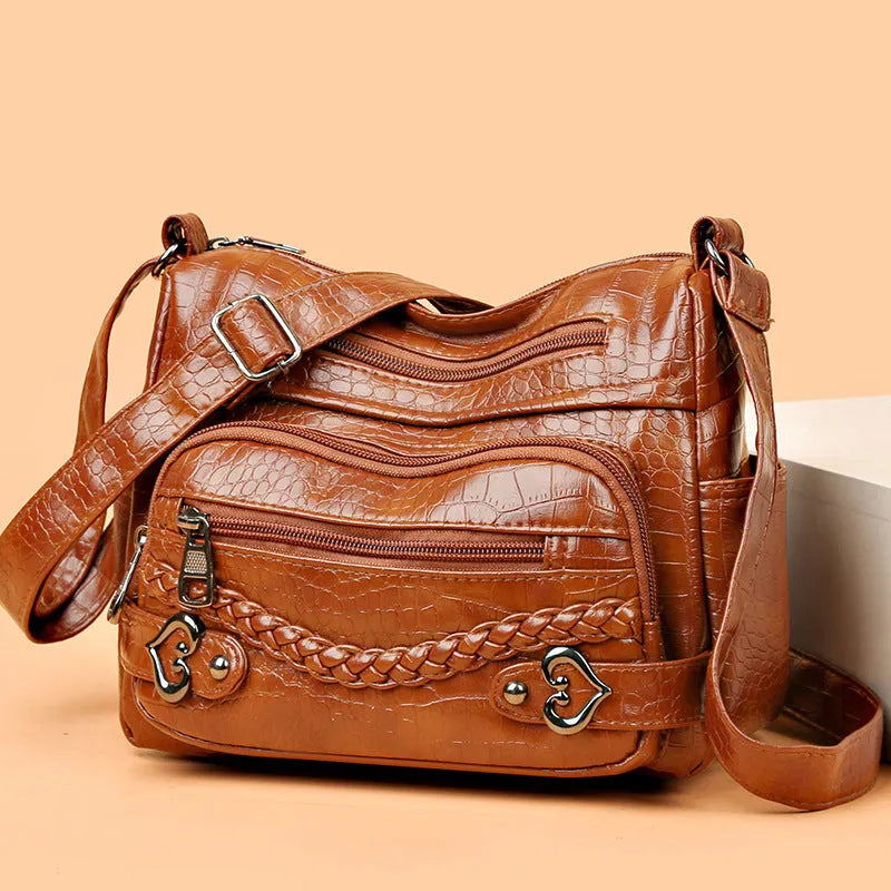 Large capacity knitted messenger bag in brown with PU leather trim, zip closure, and outer pocket, 23x11x17cm