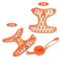 Reflective vest-style small dog harness with chest strap and attached walking rope in carrot colour