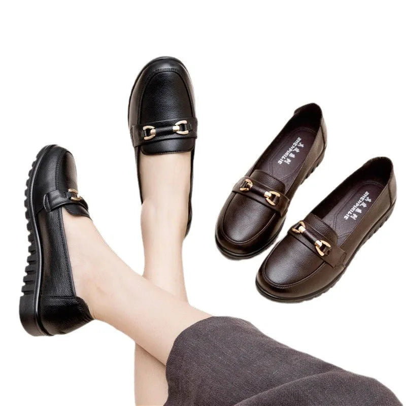 Black women's round-toe pumps with a low flat heel and elastic slip-on design.