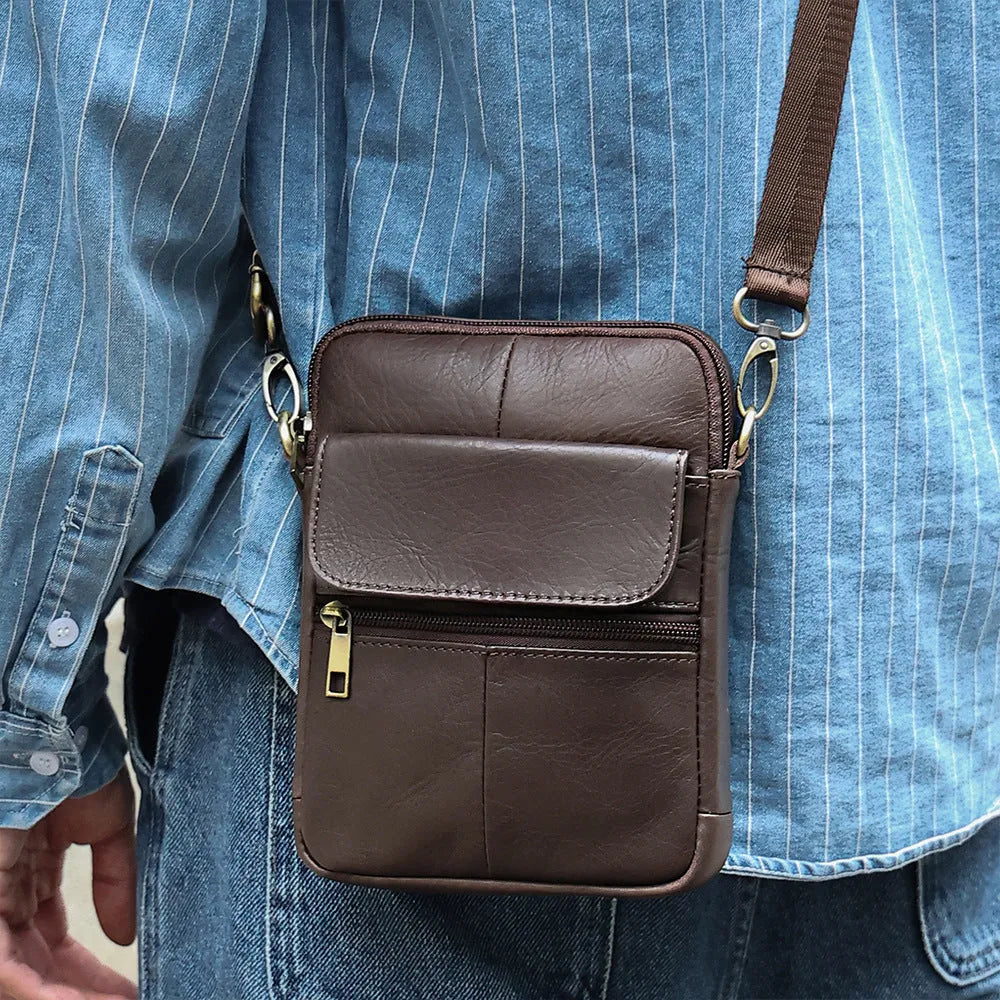 Men's brown genuine leather crossbody shoulder bag with sewing line detail.
