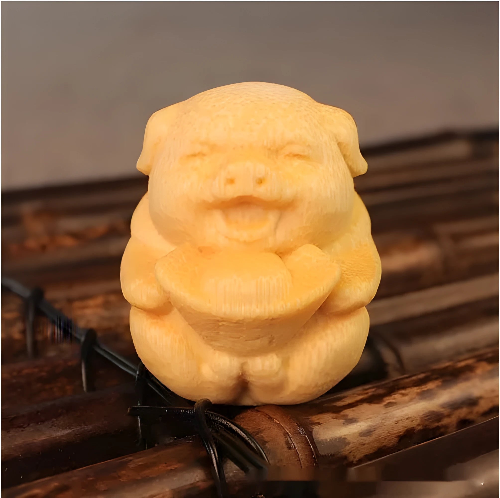 Solid bamboo carving ornament of a cute ingot pig, 4cm tall by 3.5cm diameter.