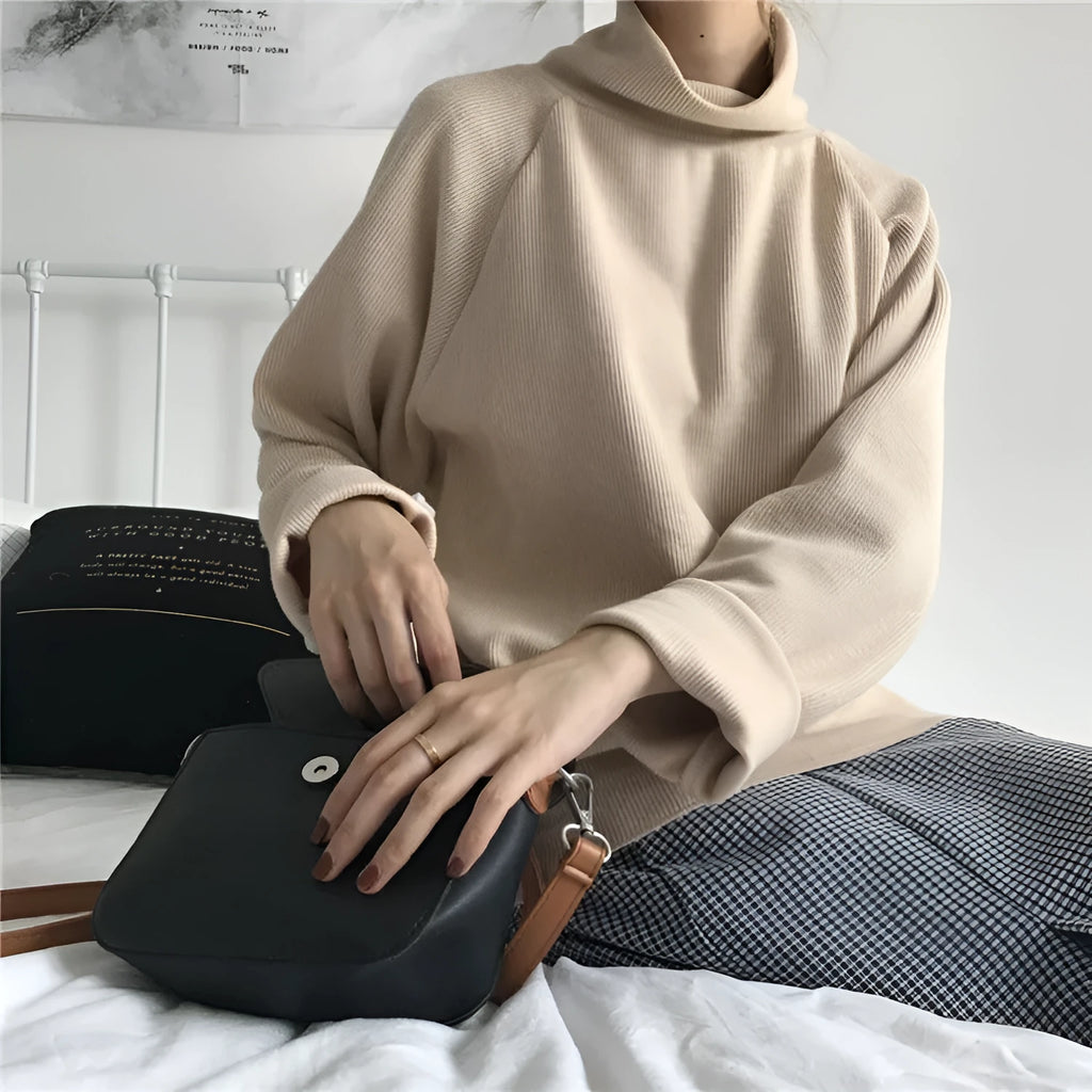 Women's loose fit long sleeve top with half-high collar in solid apricot colour